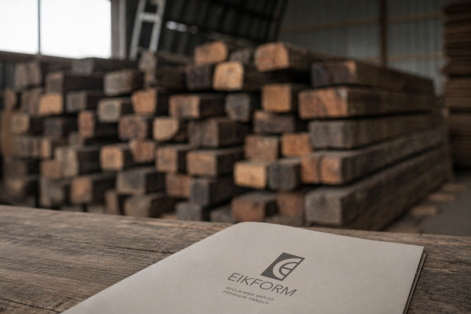 EIKFORM branded folder on reclaimed oak with raw barn-oak stack in the background